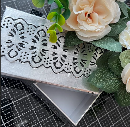 An image showcasing a completed metal-embossed box, representing the product being sold.